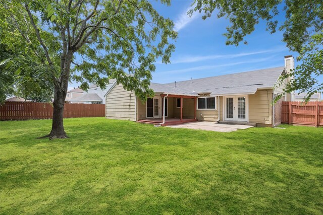 2017 Jessie Pl, Edgecliff Village, TX 76134 - back of property featuring french doors, a fenced backyard, a patio area, and a chimney