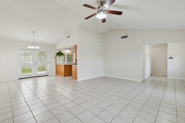 2017 Jessie Pl, Edgecliff Village, TX 76134 - unfurnished living room with vaulted ceiling, a ceiling fan, a textured ceiling, a chandelier, and light tile patterned floors