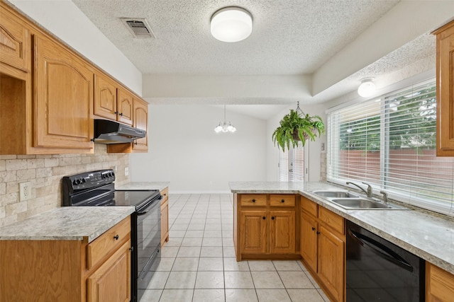 2017 Jessie Pl, Edgecliff Village, TX 76134 - kitchen with black appliances, under cabinet range hood, light countertops, light tile patterned floors, and a textured ceiling