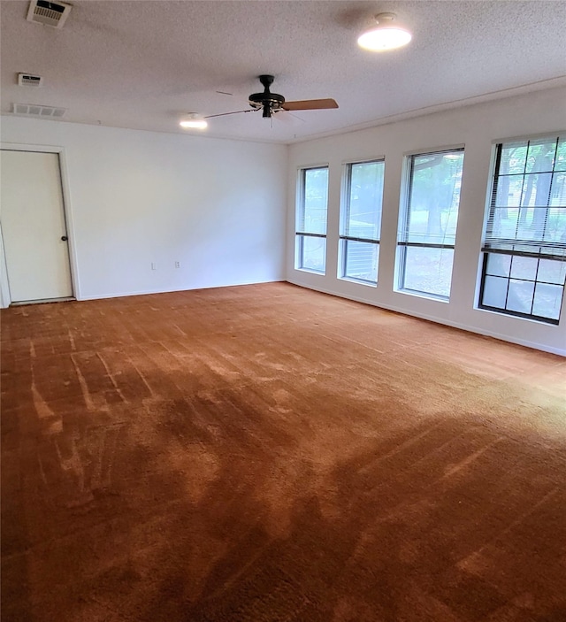 697 Highland Crest Dr, Hurst, TX 76054 - unfurnished room featuring carpet floors, a ceiling fan, and a textured ceiling