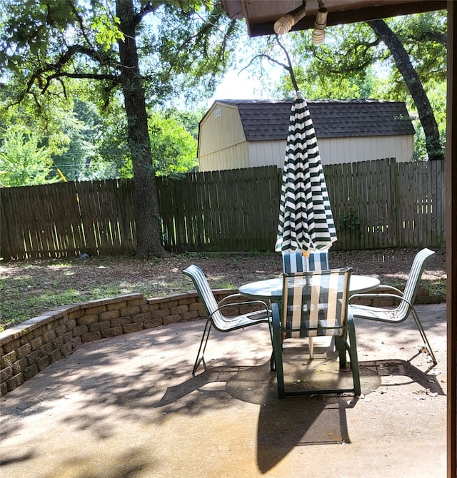 697 Highland Crest Dr, Hurst, TX 76054 - fenced backyard with outdoor dining space and a patio area
