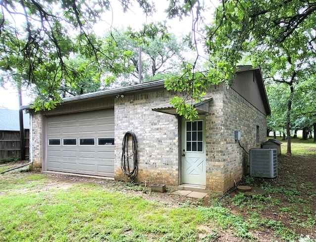 697 Highland Crest Dr, Hurst, TX 76054 - view of side of property featuring a central air condition unit and brick siding