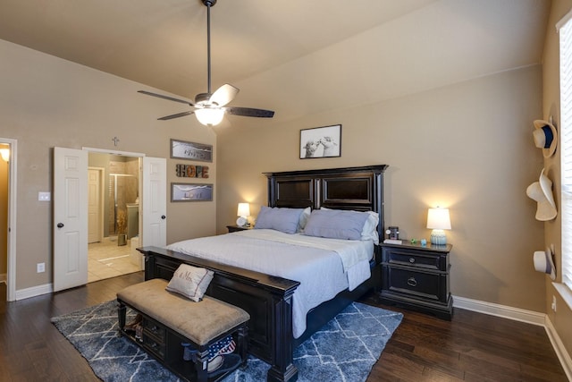 1970 Lake Forest Dr, Rockwall, TX 75087 - bedroom with dark wood-type flooring, vaulted ceiling, connected bathroom, and a ceiling fan