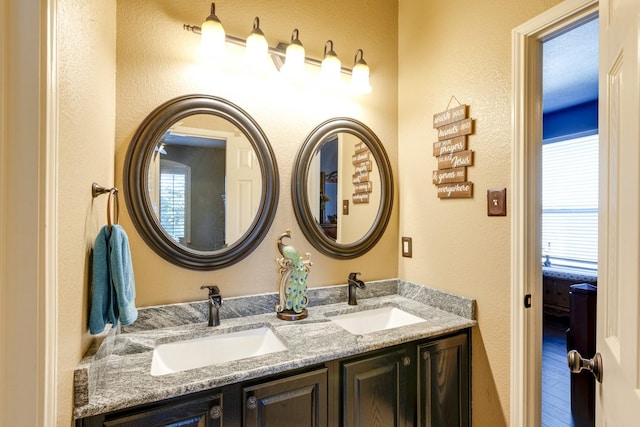 1970 Lake Forest Dr, Rockwall, TX 75087 - full bathroom featuring double vanity and a textured wall