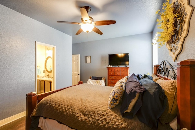1970 Lake Forest Dr, Rockwall, TX 75087 - bedroom with wood finished floors, a textured wall, a ceiling fan, and ensuite bath