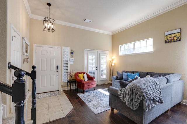 1970 Lake Forest Dr, Rockwall, TX 75087 - living room with ornamental molding, a chandelier, and dark wood-style flooring