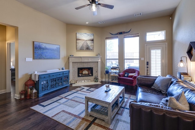 1970 Lake Forest Dr, Rockwall, TX 75087 - living room featuring ceiling fan, a tiled fireplace, and wood finished floors