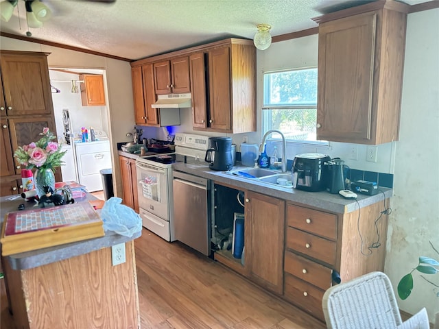 295 Denton Heights Ln, Weatherford, TX 76085 - kitchen with white electric range oven, under cabinet range hood, stainless steel dishwasher, washer / dryer, and a textured ceiling