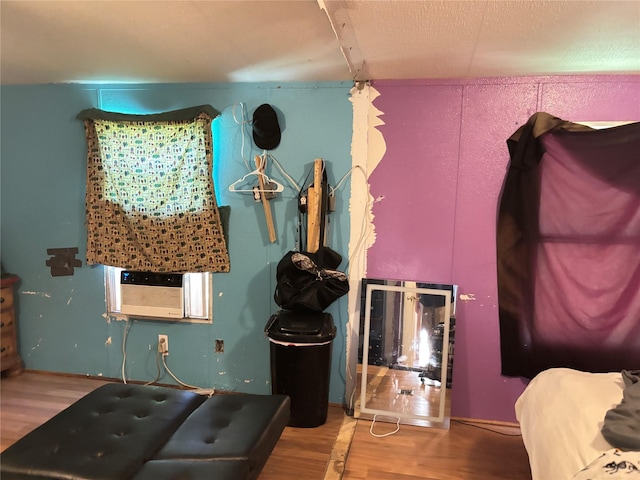 295 Denton Heights Ln, Weatherford, TX 76085 - bedroom featuring wood finished floors and cooling unit