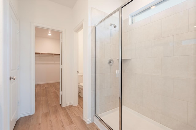 219 Autumn Sage Ln, Princeton, TX 75407 - full bathroom with a shower stall, wood finished floors, and a spacious closet