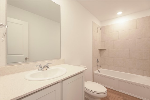 219 Autumn Sage Ln, Princeton, TX 75407 - bathroom featuring wood finished floors, vanity, tub / shower combination, and recessed lighting