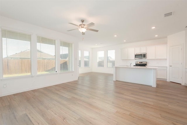 219 Autumn Sage Ln, Princeton, TX 75407 - unfurnished living room with light wood finished floors, ceiling fan, and recessed lighting