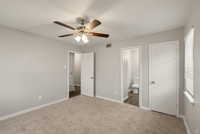 2405 Patricia Ln, Garland, TX 75041 - unfurnished bedroom with carpet floors, ensuite bathroom, and a ceiling fan