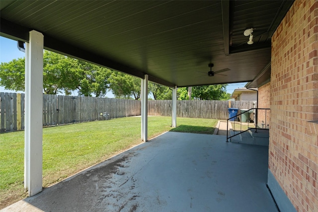 2405 Patricia Ln, Garland, TX 75041 - fenced backyard with a patio and ceiling fan