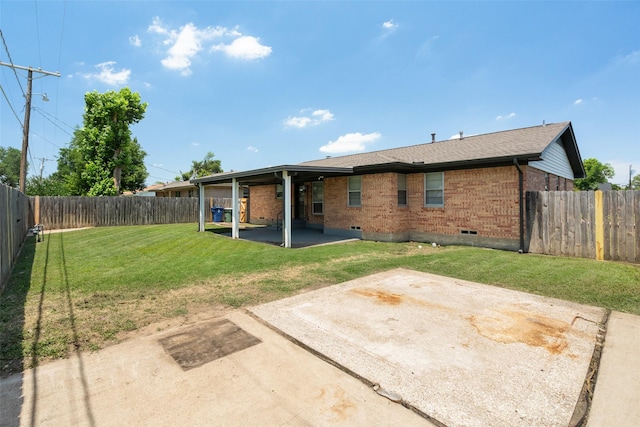 2405 Patricia Ln, Garland, TX 75041 - back of property with brick siding, a patio, and a fenced backyard
