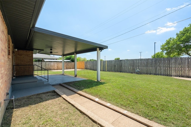 2405 Patricia Ln, Garland, TX 75041 - fenced backyard with a ceiling fan and a patio