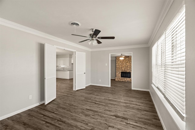 2405 Patricia Ln, Garland, TX 75041 - spare room with a ceiling fan, dark wood-type flooring, a fireplace, and ornamental molding