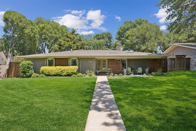 2924 Whitemarsh Cir, Richardson, TX 75080 - view of front of property with a chimney and brick siding
