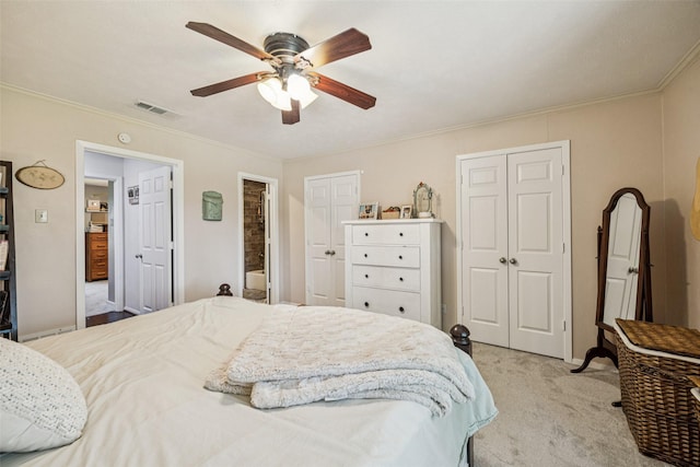 2924 Whitemarsh Cir, Richardson, TX 75080 - bedroom featuring light colored carpet, crown molding, two closets, and a ceiling fan