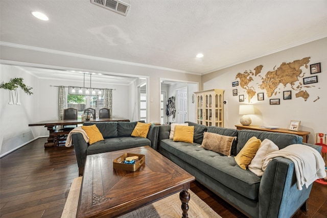 2924 Whitemarsh Cir, Richardson, TX 75080 - living room with crown molding, dark wood-style flooring, recessed lighting, and a textured ceiling