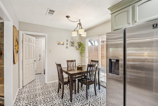 2924 Whitemarsh Cir, Richardson, TX 75080 - dining room featuring baseboards and a textured ceiling