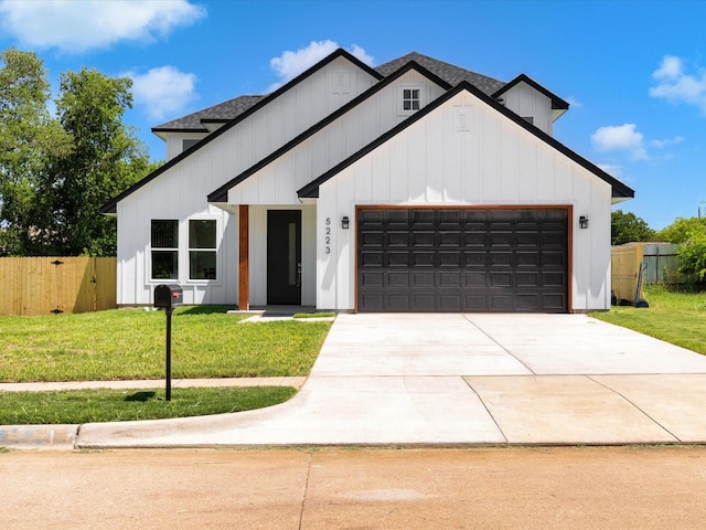 5223 Willie St, Fort Worth, TX 76105 - modern inspired farmhouse with an attached garage, board and batten siding, driveway, and a shingled roof