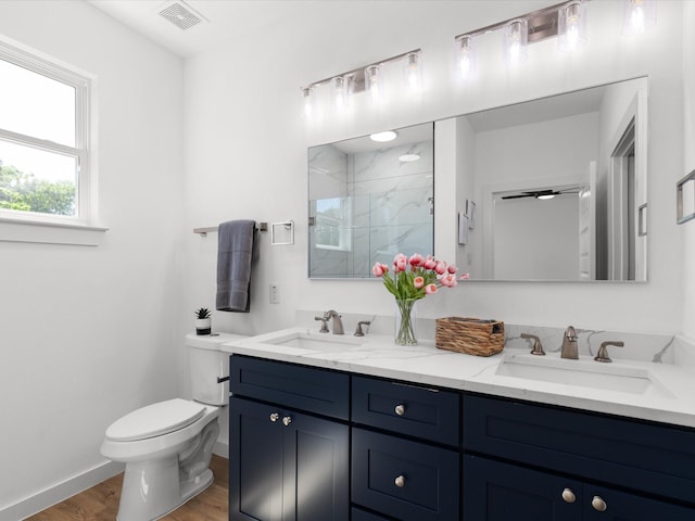 5223 Willie St, Fort Worth, TX 76105 - full bath with double vanity, a marble finish shower, and wood finished floors