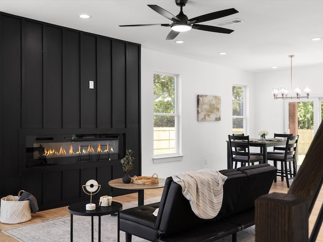 5223 Willie St, Fort Worth, TX 76105 - living area with a large fireplace, plenty of natural light, recessed lighting, a chandelier, and light wood finished floors