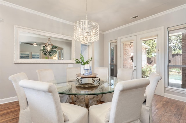 11640 Mesa Verde Dr, Frisco, TX 75033 - dining area featuring wood finished floors, crown molding, and a chandelier
