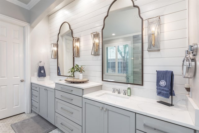 11640 Mesa Verde Dr, Frisco, TX 75033 - bathroom featuring ornamental molding, vanity, and wood walls