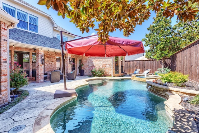 11640 Mesa Verde Dr, Frisco, TX 75033 - view of swimming pool featuring a fenced backyard, a ceiling fan, a patio, a pool with connected hot tub, and an outdoor living space