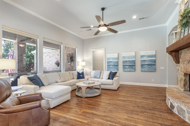 11640 Mesa Verde Dr, Frisco, TX 75033 - living area with ceiling fan, crown molding, wood finished floors, a stone fireplace, and recessed lighting