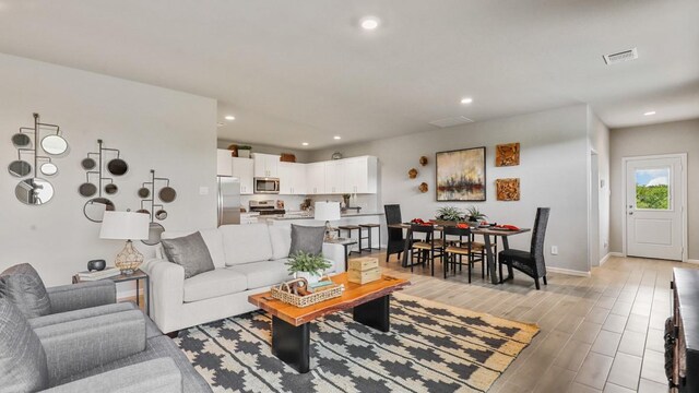 6628 Windfall Dr, Fort Worth, TX 76135 - living area featuring light wood finished floors and recessed lighting