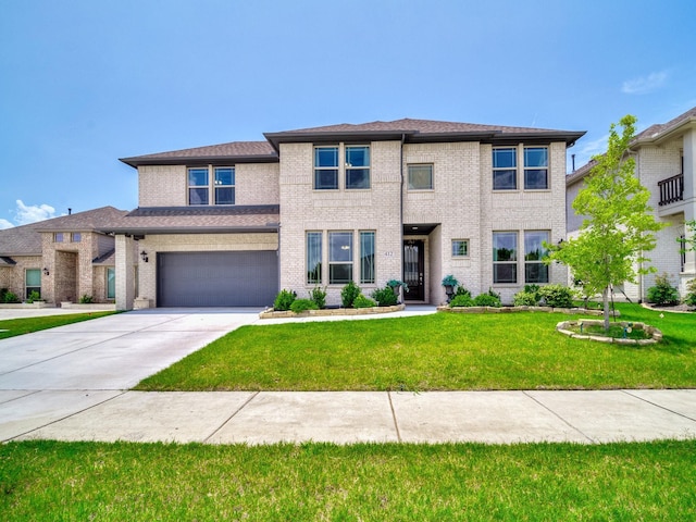 412 Navo Rd, Little Elm, TX 75068 - view of front facade featuring concrete driveway, a front yard, a garage, and brick siding