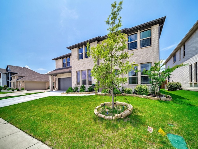 412 Navo Rd, Little Elm, TX 75068 - view of front of house featuring concrete driveway, a front yard, and brick siding