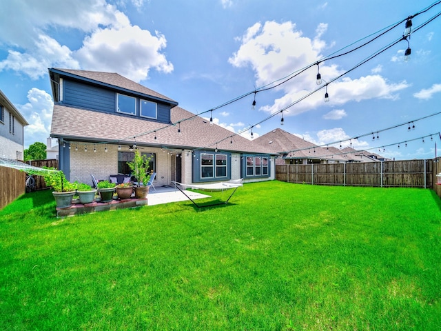 412 Navo Rd, Little Elm, TX 75068 - back of property with a fenced backyard, a shingled roof, a patio, a ceiling fan, and brick siding