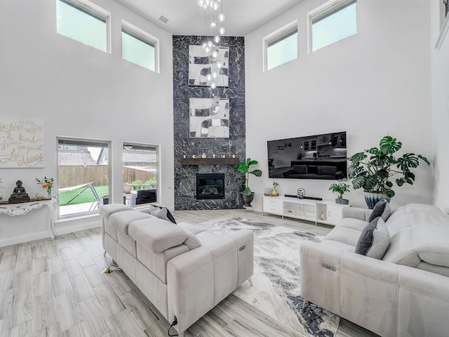 412 Navo Rd, Little Elm, TX 75068 - living room featuring a high ceiling and a fireplace