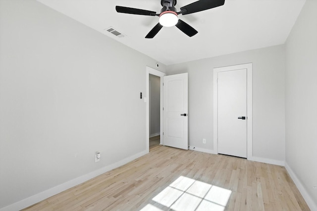 736 Wilson St, Denton, TX 76205 - unfurnished bedroom with wood finished floors and a ceiling fan