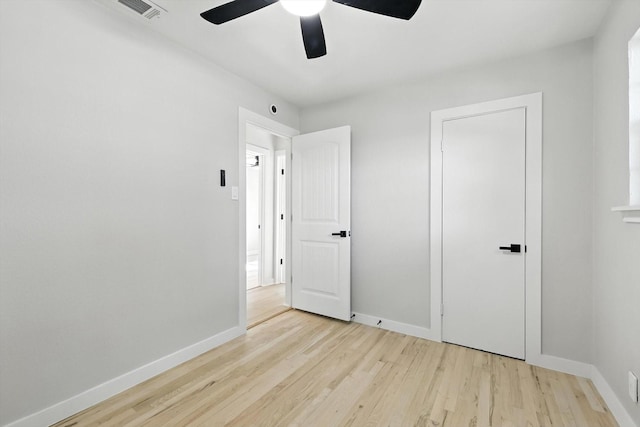 736 Wilson St, Denton, TX 76205 - unfurnished bedroom featuring wood finished floors and a ceiling fan