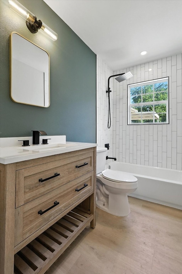 736 Wilson St, Denton, TX 76205 - full bath featuring vanity, shower / bath combination, wood finished floors, and recessed lighting
