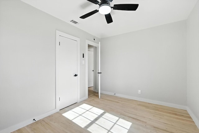 736 Wilson St, Denton, TX 76205 - unfurnished bedroom featuring wood finished floors and ceiling fan