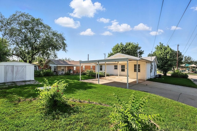 736 Wilson St, Denton, TX 76205 - rear view of house featuring a storage unit, a patio area, and a yard