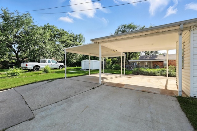 736 Wilson St, Denton, TX 76205 - view of parking featuring a shed, driveway, and a carport