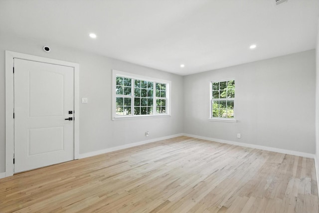 736 Wilson St, Denton, TX 76205 - empty room with light wood finished floors and recessed lighting