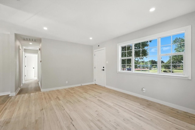 736 Wilson St, Denton, TX 76205 - empty room featuring light wood-style flooring and recessed lighting