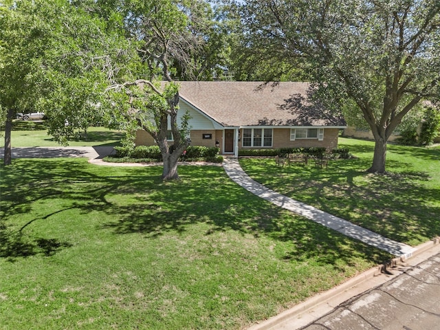 5819 Fairview Dr, Waco, TX 76710 - single story home featuring a front lawn, roof with shingles, and brick siding