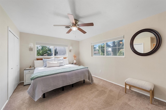 5819 Fairview Dr, Waco, TX 76710 - bedroom with multiple windows, light colored carpet, and ceiling fan