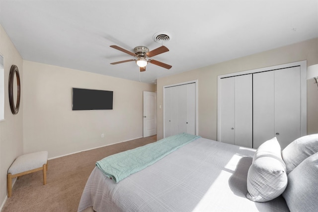 5819 Fairview Dr, Waco, TX 76710 - carpeted bedroom featuring multiple closets and a ceiling fan