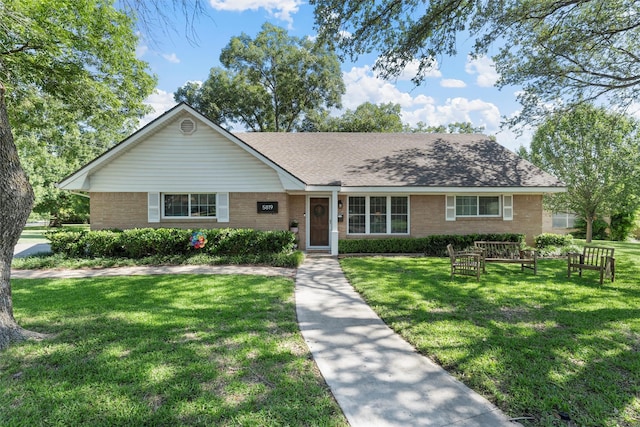 5819 Fairview Dr, Waco, TX 76710 - single story home featuring brick siding, a front lawn, and a shingled roof