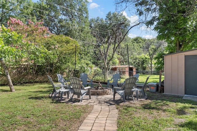 5819 Fairview Dr, Waco, TX 76710 - view of yard with a storage shed, an outdoor fire pit, and a patio area